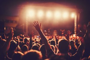 Big concert audience listening to music at festival